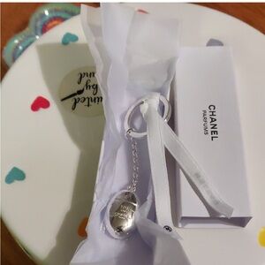 Chanel Silver Keychain with White Ribbon